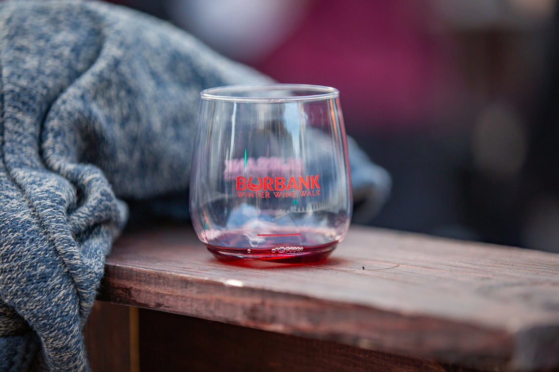 A branded Burbank Winter Wine Walk tasting glass