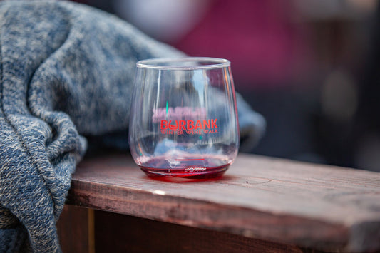 A branded Burbank Winter Wine Walk tasting glass